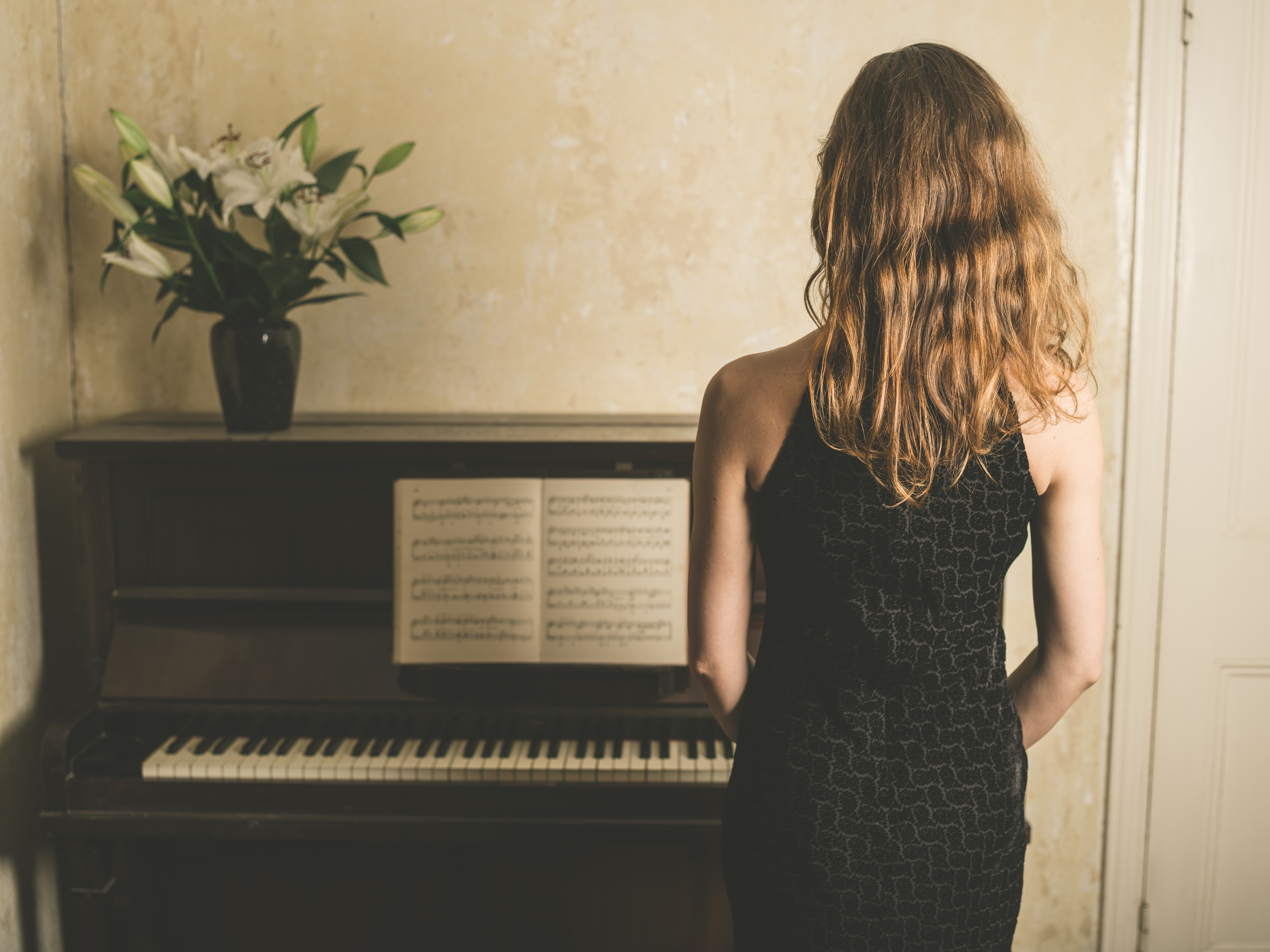 Woman in Dress by the Piano